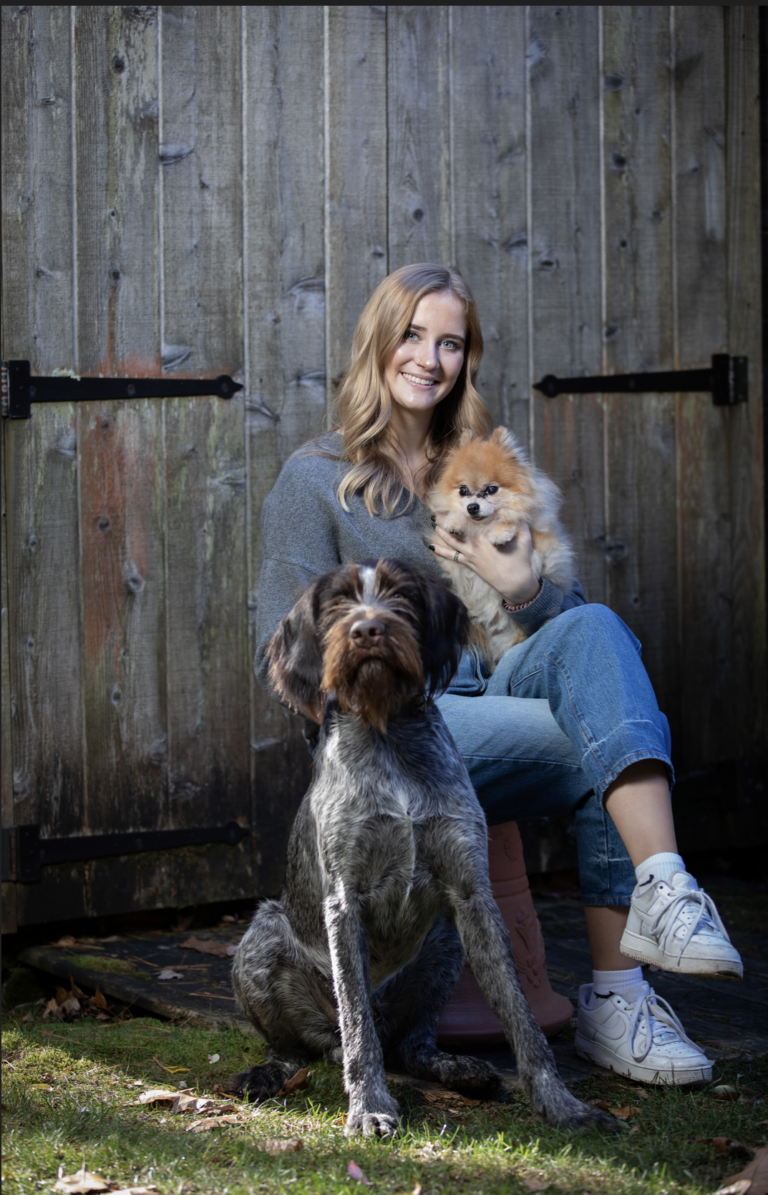 headshot of Grace with her two dogs